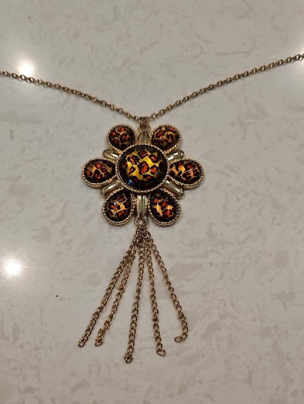 Gold-Tone Floral Pendant Necklace with Leopard Enamel Accents